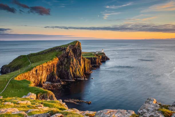 Neist Point on the Isle of Skye Sunset on Neist Point - Isle of Skye coastal feature stock pictures, royalty-free photos & images