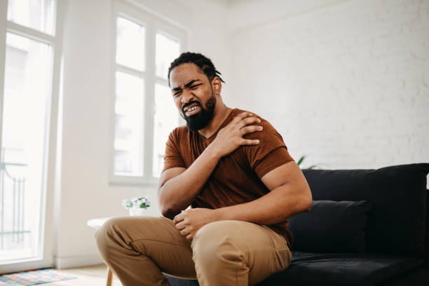 istock Middle aged man has shoulder pain. with copy space for text 1388235145