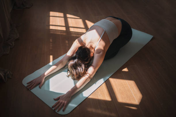 istock Woman practising yoga in studio. 1388235178