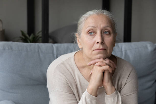 istock Sad lonely pensive elder lady looking away 1388244179