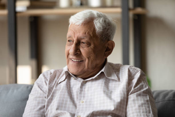 istock Positive pensive older 80s man looking away with good thoughts 1388244248