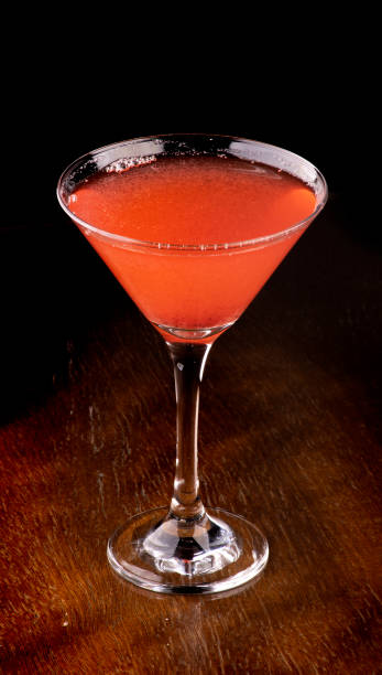 istock cosmopolitan cocktail in martini glass on wooden table 1388244470