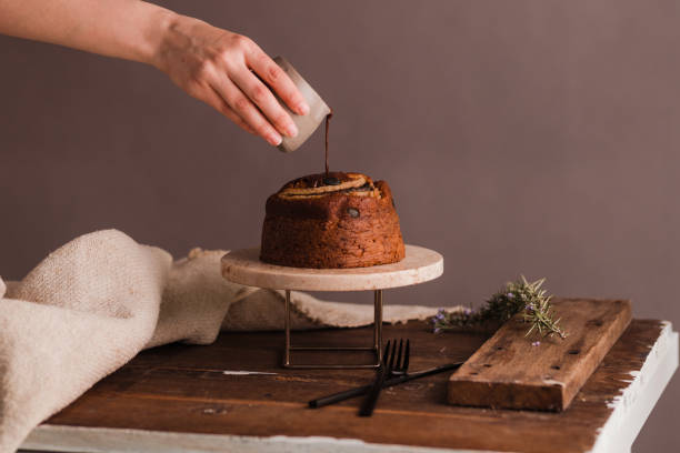 istock Female hands decoration banana bread 1388245317