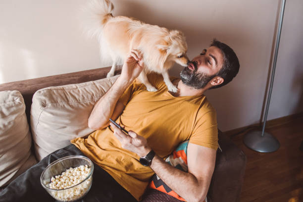 istock A man having moments of affection with his dog 1388245596
