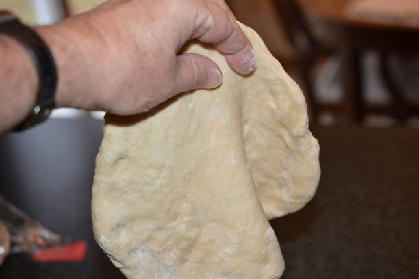 istock Pizza Dough Thinning in the center 1388245887