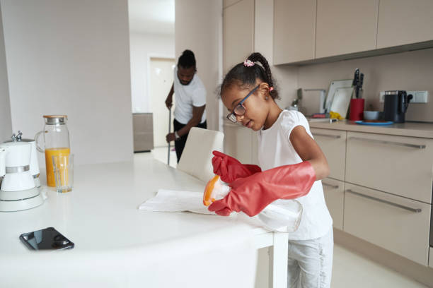 istock Little girl helping her father with housework 1388249509