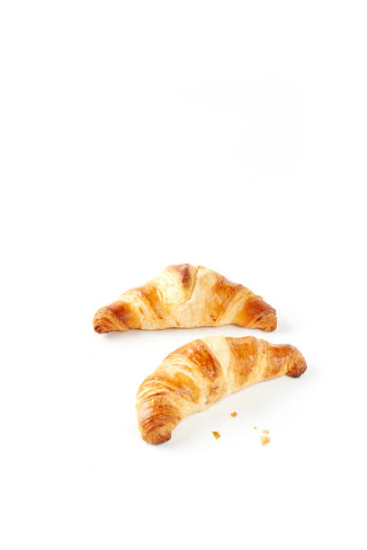 istock Breakfast or lunch concept. Croissants isolated on white background 1388250909