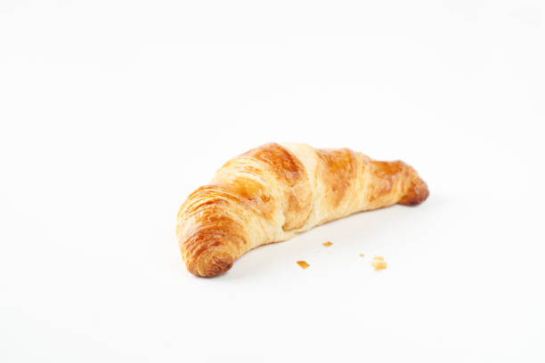 istock Breakfast or lunch concept. Croissants isolated on white background 1388250933