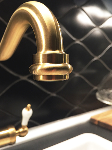 Close-up gold colored faucet