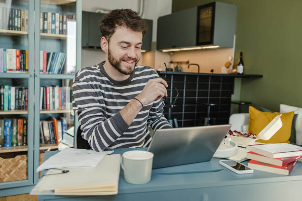 istock Working on laptop at home 1388254508