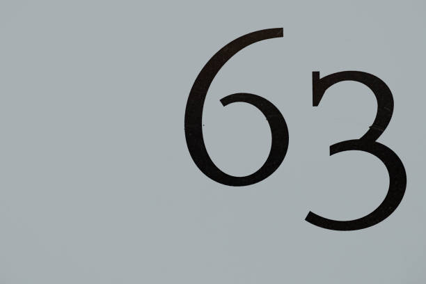 istock house number 63 painted at the  wall 1388259603