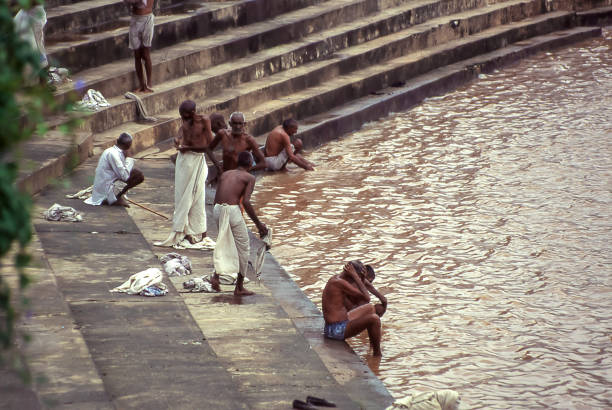 Pushkar, India - aug  6, 1996:   pilgrims flock to the ghats of Pushkar Lake for purifying ablutions rituals, in Pushkar  Vintage photo. Historical archive photo.