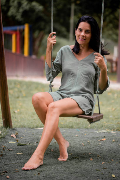 istock Woman bouncing at a playground 1388262947