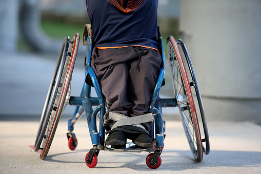 Focus on a Muslim athlete on wheelchair.