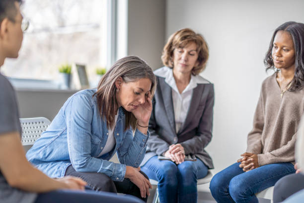 istock Depressed Woman in Counseling 1388265660