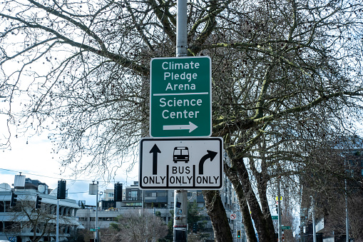 Seattle, WA USA - circa March 2022: View of directional traffic signs for the Climate Pledge Arena and Science Center.