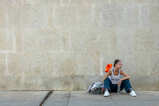 istock Street dancer rests shaking her hat on her head 1388267731