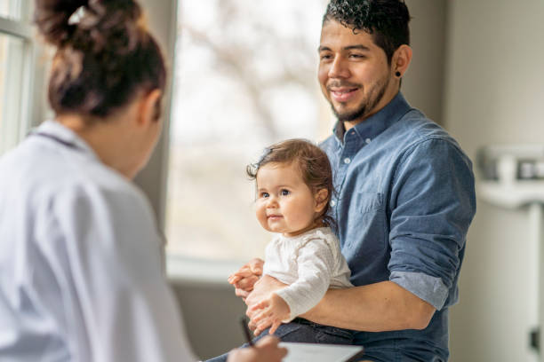 istock Father and Daughter at the Doctors 1388268578