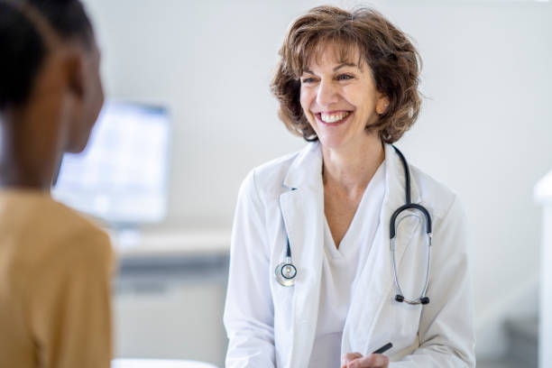 istock Doctor Talking with a Young Patient 1388268589