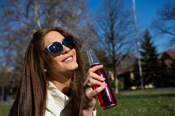 istock Young happy, beautiful woman enjoying refreshment 1388271098