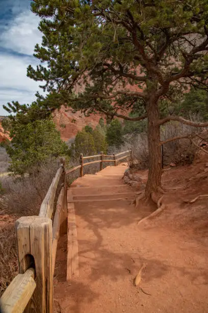 Photo of Footpath to ancient sandstone rock formations of Garden of the Gods and Pikes Peak forest