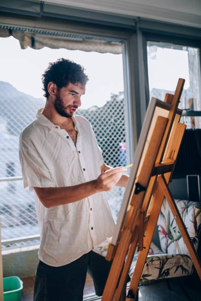 istock Artist painting at home 1388276820