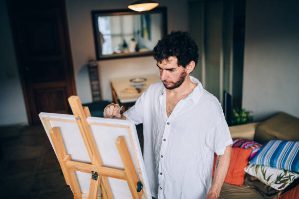 istock Artist painting at home 1388276876
