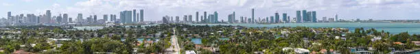 Photo of Miami skyline over wealthy Venetian Islands on a sunny day.  Extra-large, high-resolution stitched panorama.
