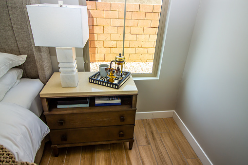 Master Bedroom Nightstand With Ceramic Table Lamp And Decorator Tray