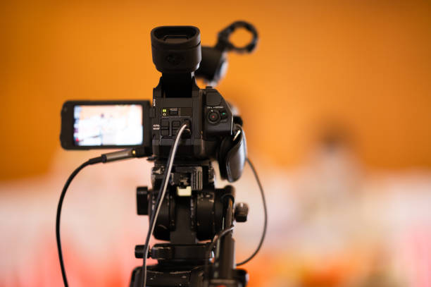 istock Video camera operator Professional camera filming a video podcast 1388293604
