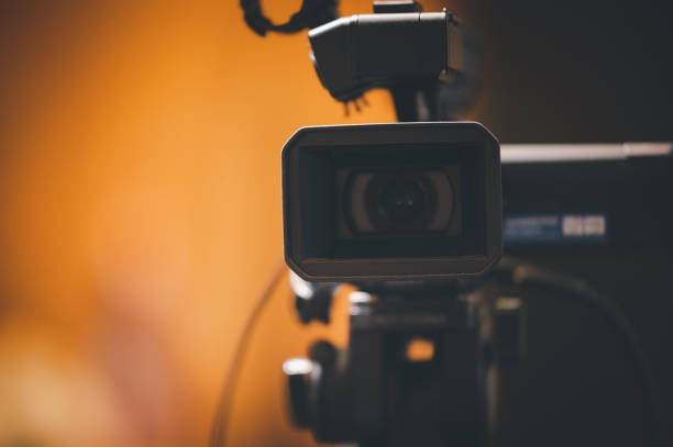 istock Video camera operator Professional camera filming a video podcast 1388293607