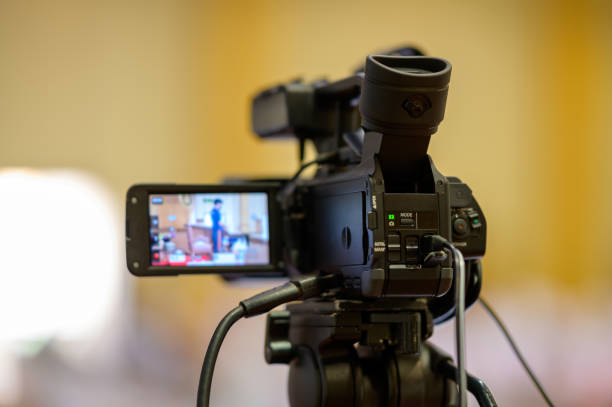 istock Video camera operator Professional camera filming a video podcast 1388293610