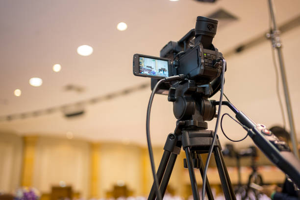 istock Video camera operator Professional camera filming a video podcast 1388293631