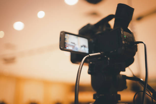 istock Video camera operator Professional camera filming a video podcast 1388293641
