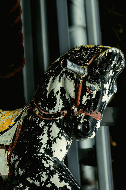 istock Old playground horse in the trash 1388296319