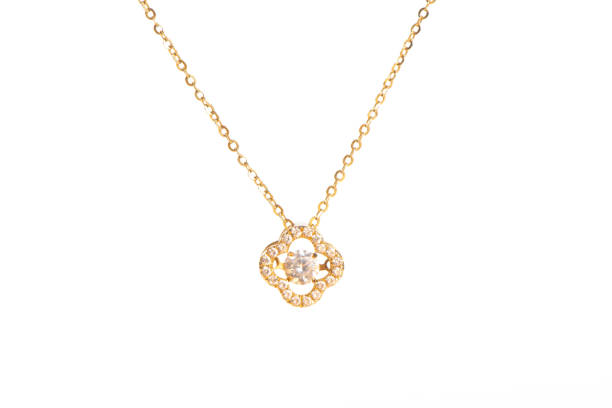 istock Golden chain necklace with diamond pendant on white background 1388297149