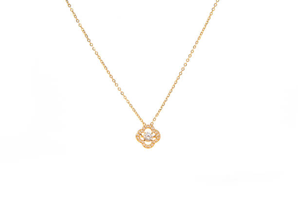 istock Golden chain necklace with diamond pendant on white background 1388297221