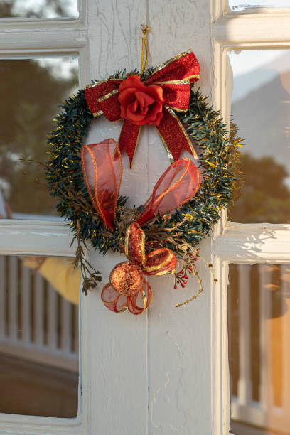 istock Christmas round wreath on a door 1388298996