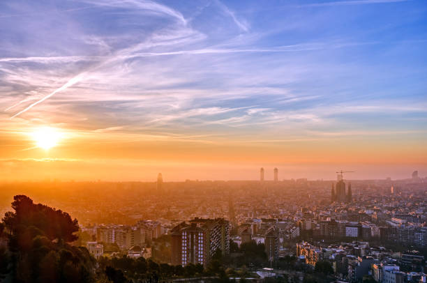 The skyline of Barcelona in Spain at a misty sunrise