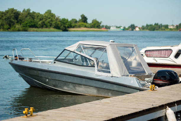 istock Motor boat moored on the river pier 1388300899