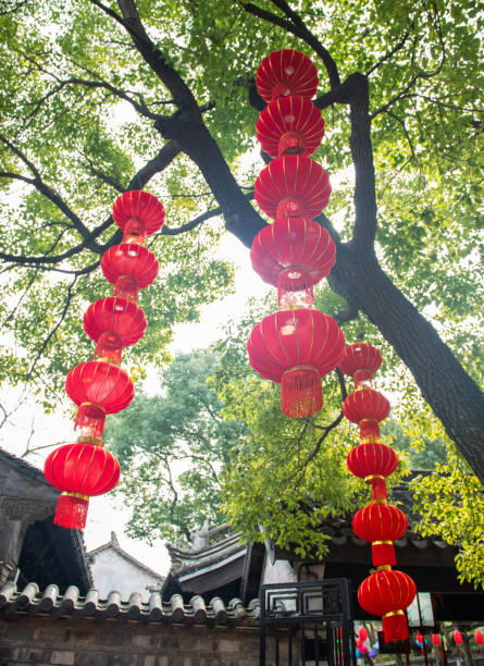 istock Strings of red lanterns hanging in the park during Chinese New Year 1388303437