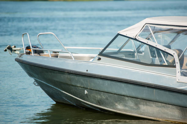 istock Motor boat moored on the river pier, close-up 1388304198