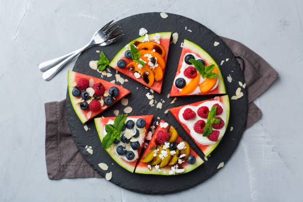 istock Watermelon pizza with berries, fruit, yogurt, feta cheese 1388308703
