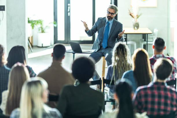 istock CEO giving a presentation in a board room. 1388311005