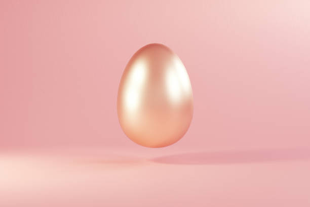 istock Easter golden glitter egg flying on pink background. Minimal easter concept. Happy Easter card with copy space for text. Levitating egg 1388311042
