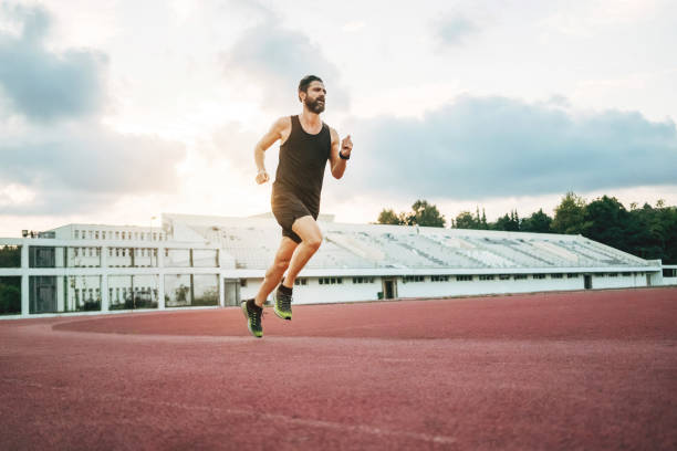 istock Man running on the track to keep fit 1388312166