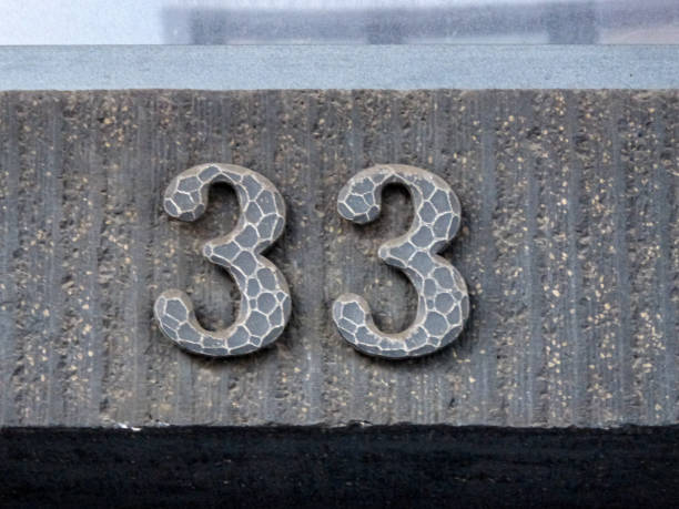 Metal home number on a wall