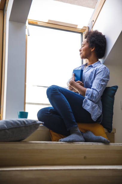 istock Embracing a book she enjoyed and finished reading 1388314184
