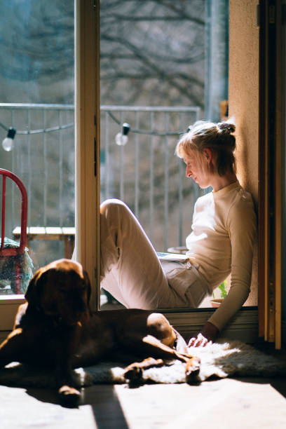 istock Woman working from home, sitting on her balcony in the sun 1388315465