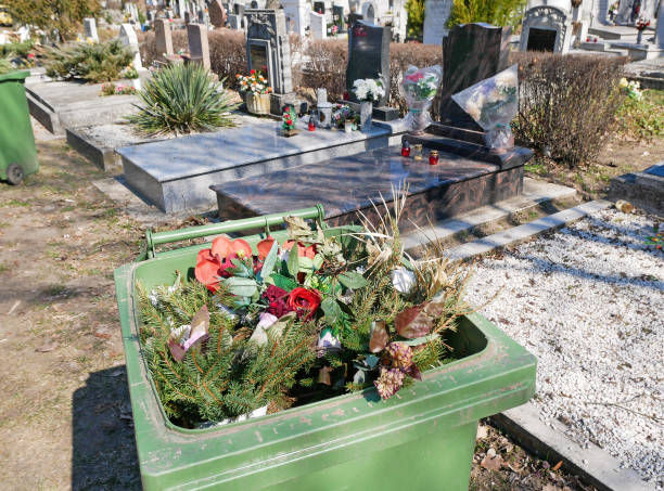 Peaceful cemetery with gravestones and floral arrangements